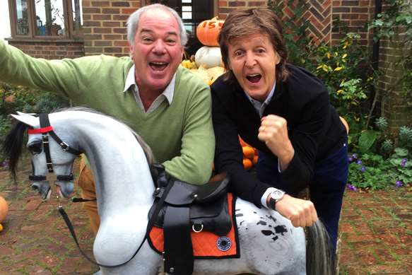 Marc Stevenson and Paul McCartney with the Moonstar rocking horse which will be auctioned for charity