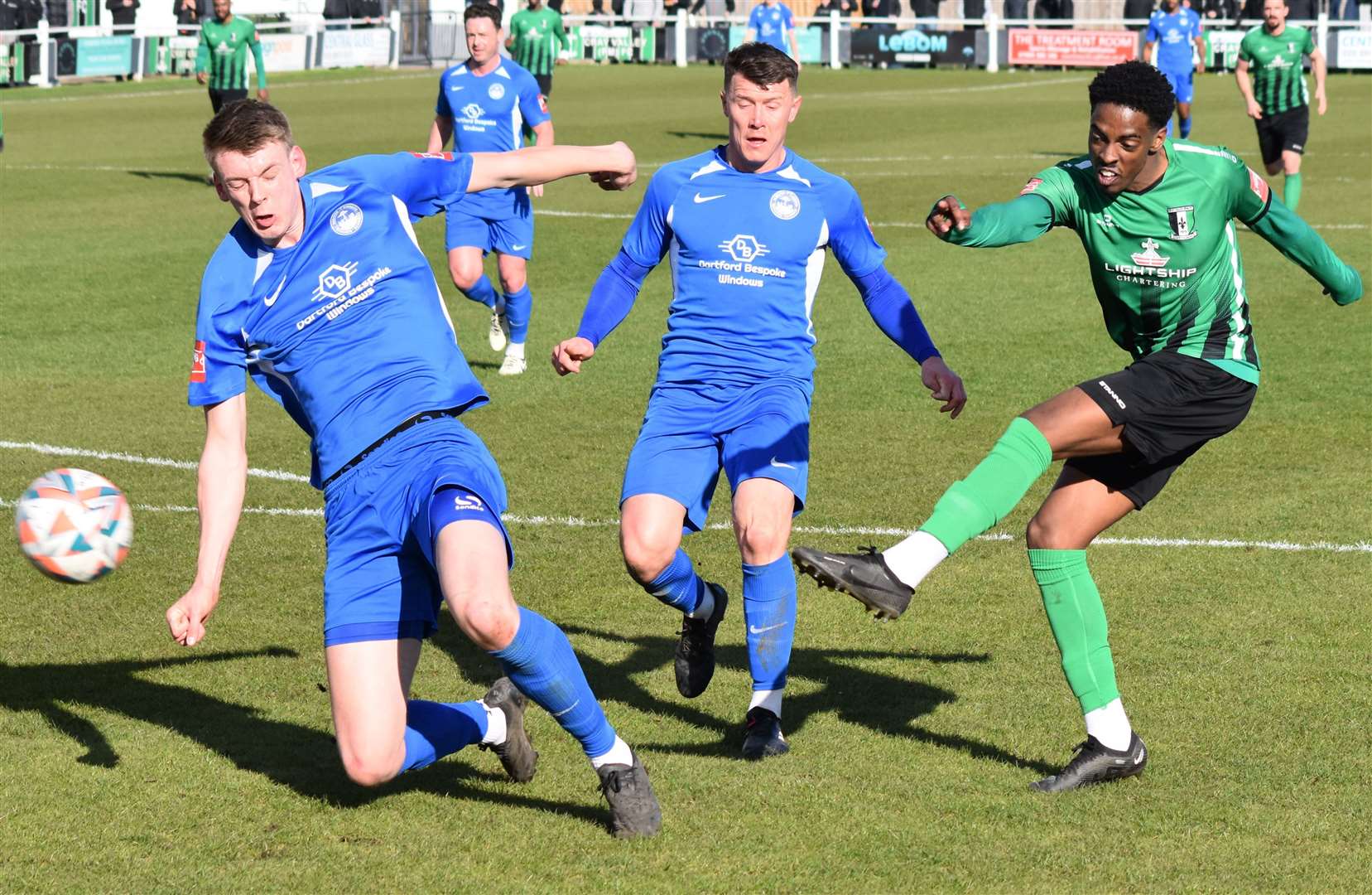 Hythe defenders Lex Allan and Sam Flisher close down Cray Valley forward Kyrell Lisbie. Picture: Alan Coomes