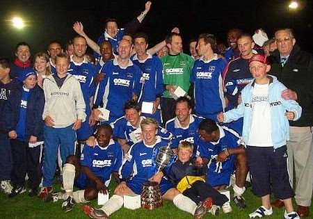 The victorious Margate squad celebrate with the trophy