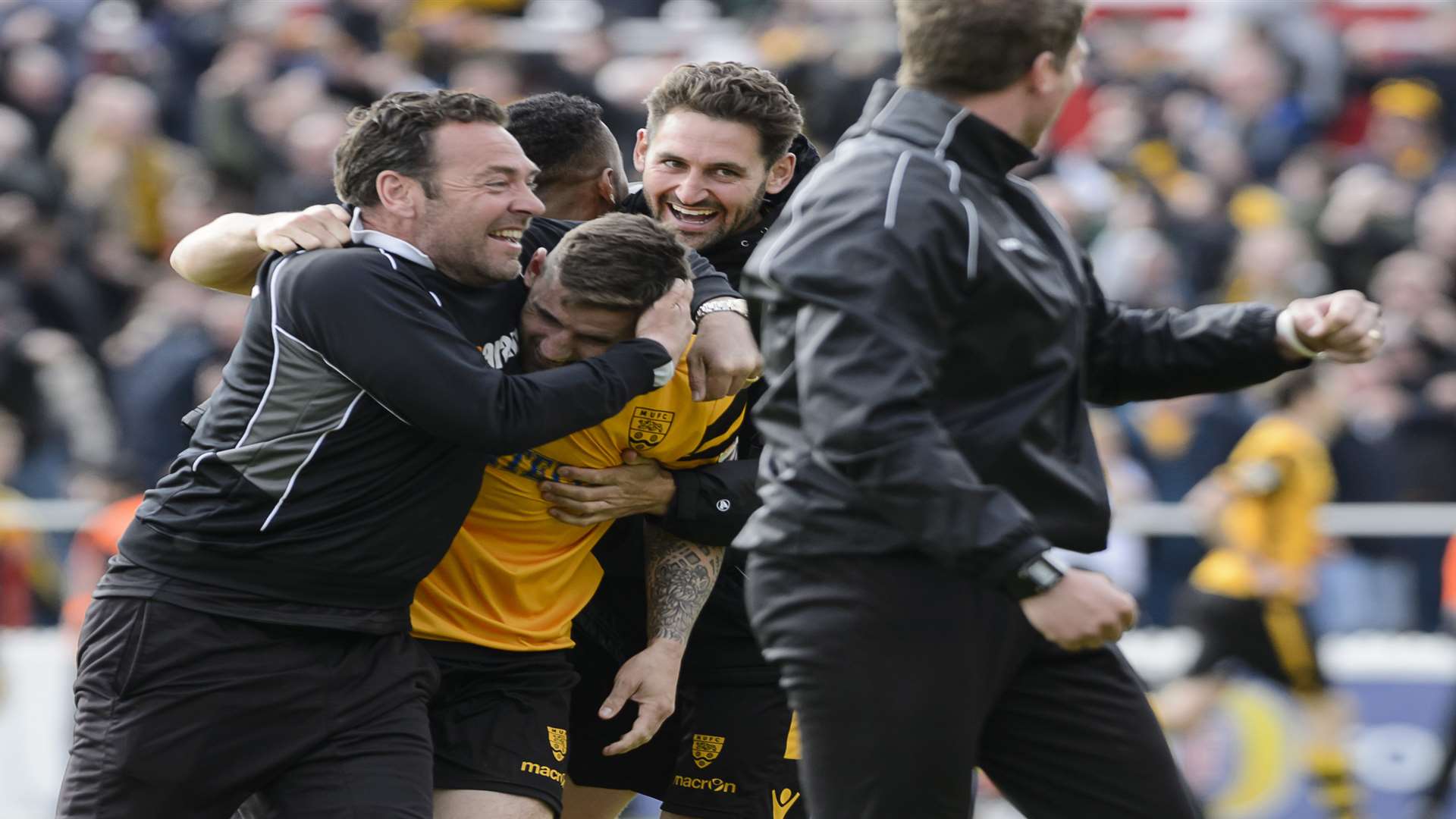 Maidstone's bench invade the pitch as the extra-time equaliser goes in. Picture: Andy Payton