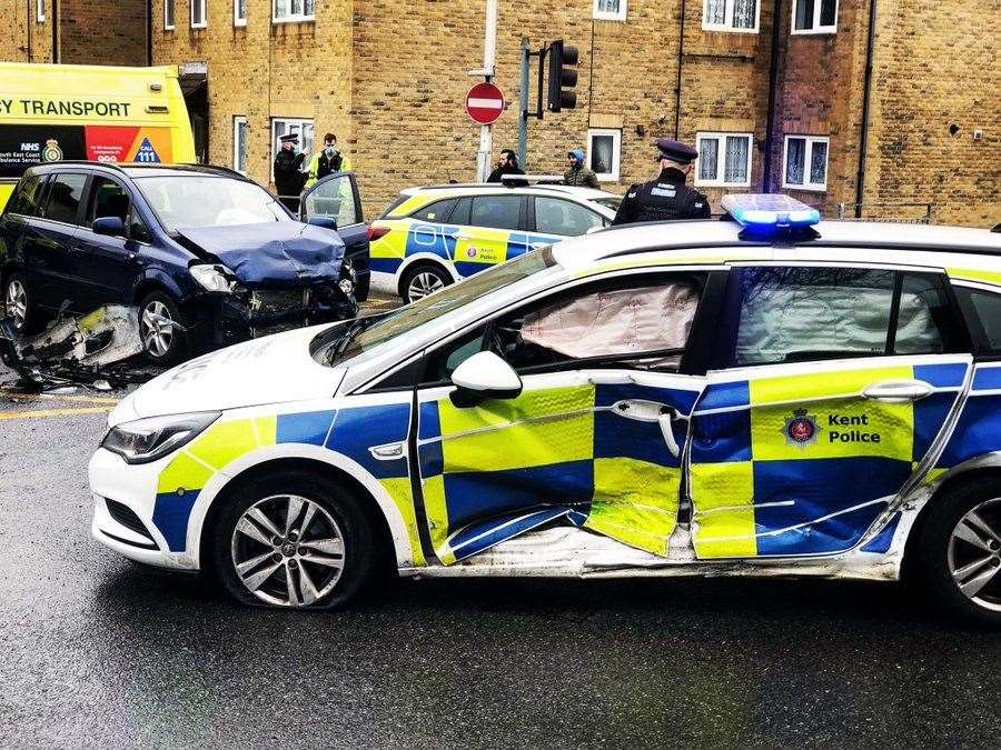The police car mangled on its left. Picture on Twitter from @bradyboyqpr