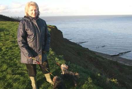 DELIGHTED: One of the residents, Viviane Burke, near the cliff edge. Picture: JOHN WESTHROP