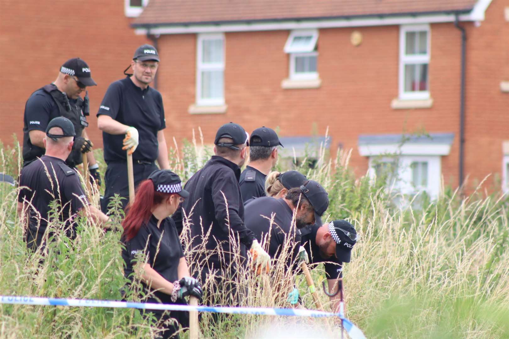 Police carrying out a search in Sittingbourne after the teenage girl was found stabbed. Picture: John Nurden