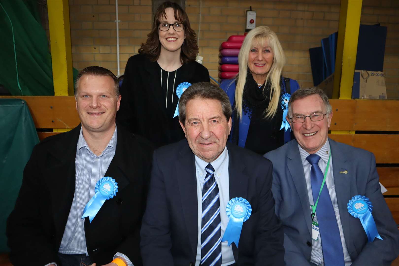 In the blue corner: victor Gordon Henderson with, on the left, former Labour candidate-turned-Tory Michael Rolfe, and on the right, county councillor Ken Pugh with at the back agent Jess McMahon and Gordon's wife Louise