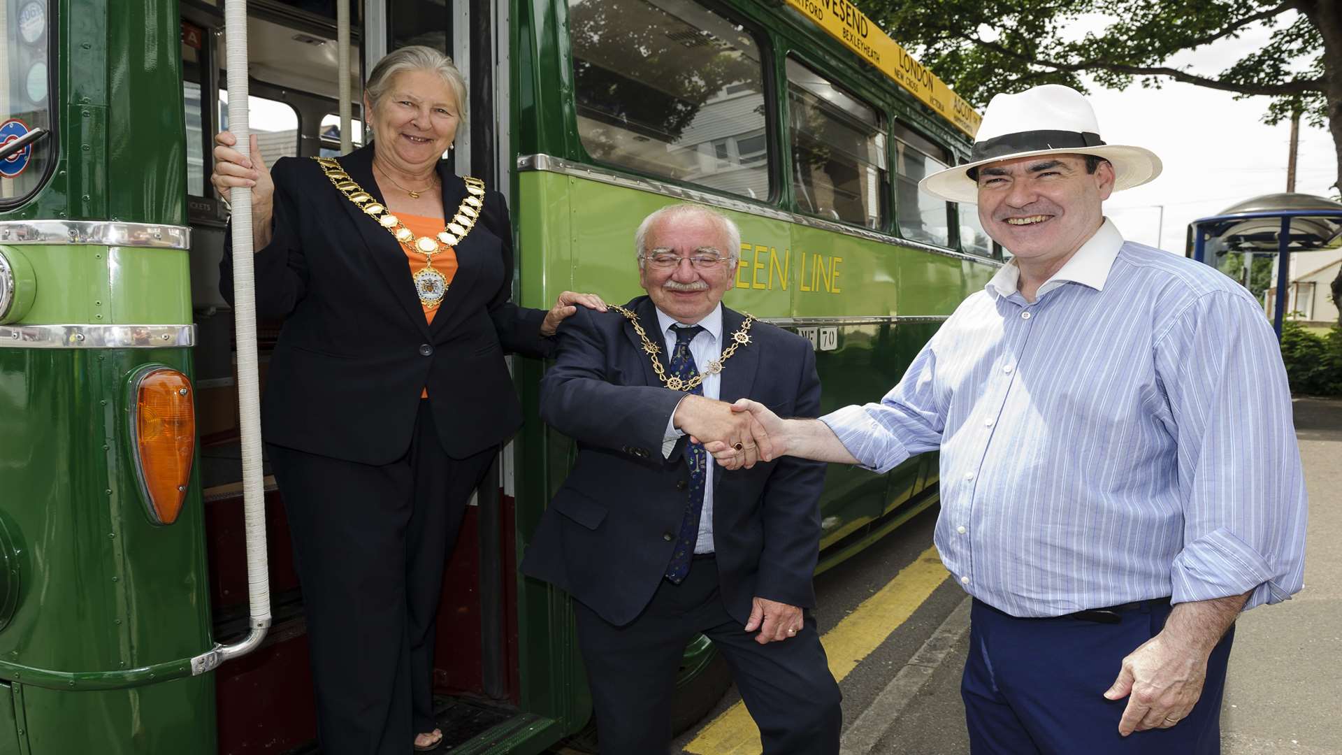 Mayor of Dartford Cllr Rosanna Currans and Mayor of Gravesham Cllr Harold Craske alight from a vintage bus to be met by general manager Andy Creba. Picture: Andy Payton