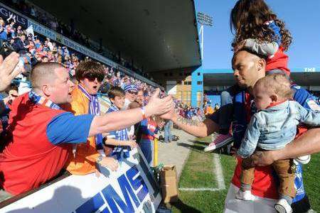 Deon Burton with fans after Gillingham sealed championship victory
