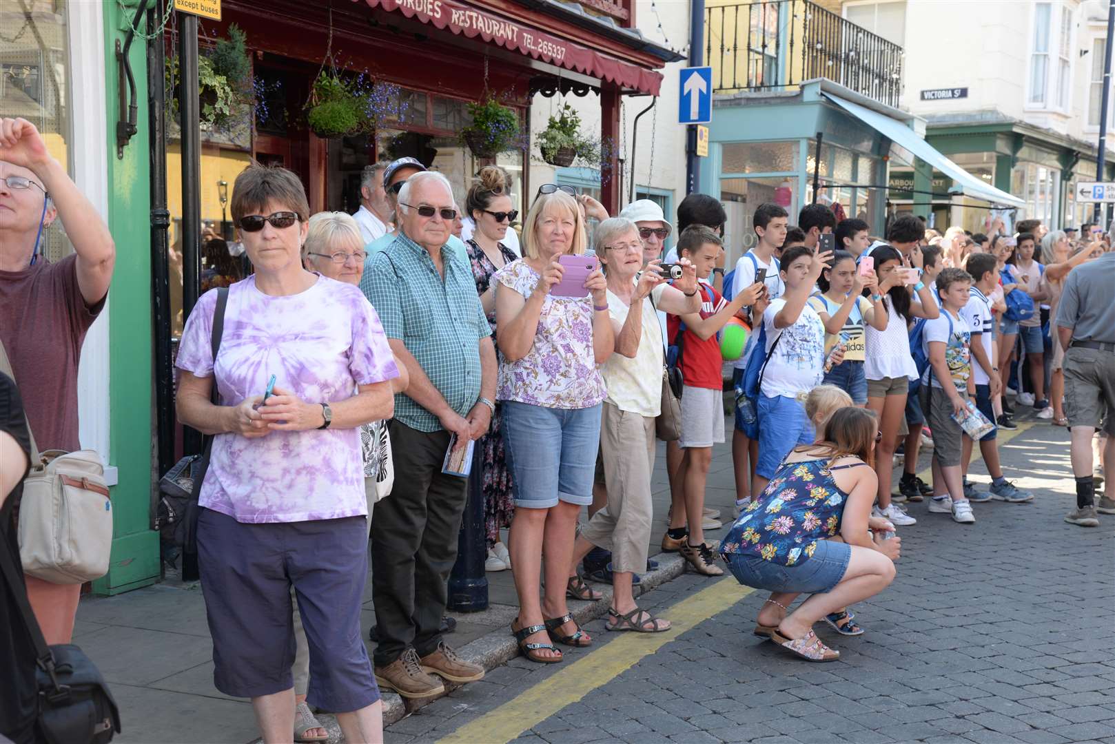 Spectators in the High Street watch the Whitstable Oyster Festival parade as it makes it's way through the town on Saturday. Picture: Chris Davey... (3192433)