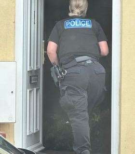 Police were seen entering properties in Gordon Road, Gillingham