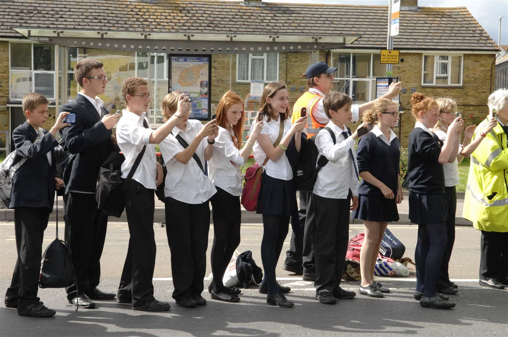Young spectators watch the torch relay in Sturry Road, Canterbury