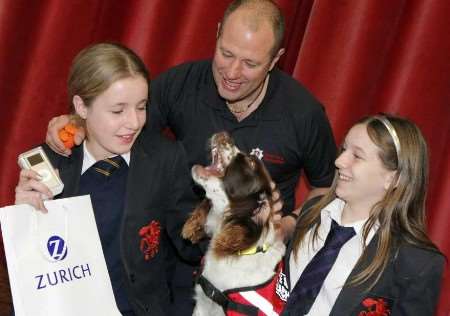 Students Rebekah Moore, left, and Toni Brown with David Hudson and his dog Meg. Picture: LEONIE FOSTER