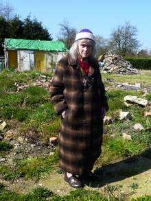 Frittenden pensioner Patricia Tilke among the rubble of her former home