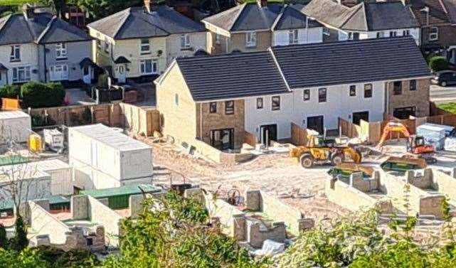 A hilltop view of the building site of the former Buckland Hospital site in Coombe Valley Road, Dover, with some houses already complete
