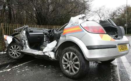 The wreckage of the police patrol car after firefighters removed the roof. Picture: JAMIE GRAY