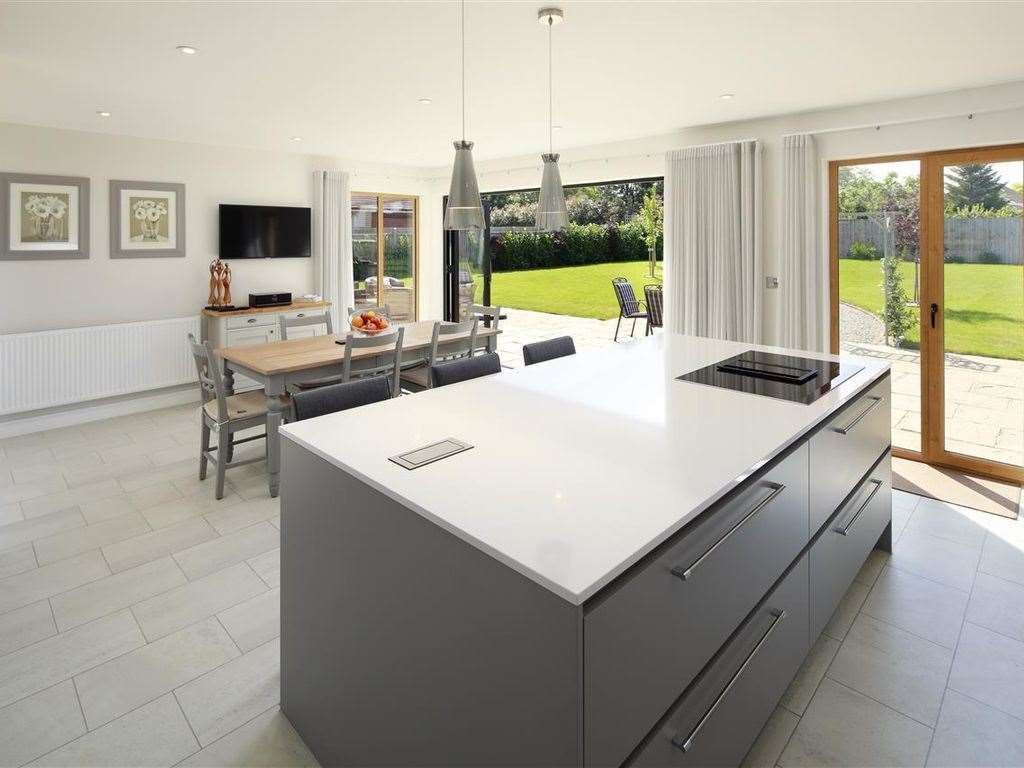An open plan kitchen and living room space opens up to the garden. Photo: Zoopla