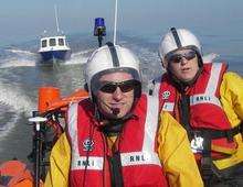 Helmsman Craig Sidders and crewmember Mike Keam onboard the Whitstable lifeboat as it tows a broken down angling boat to Herne Bay harbour on Friday afternoon.