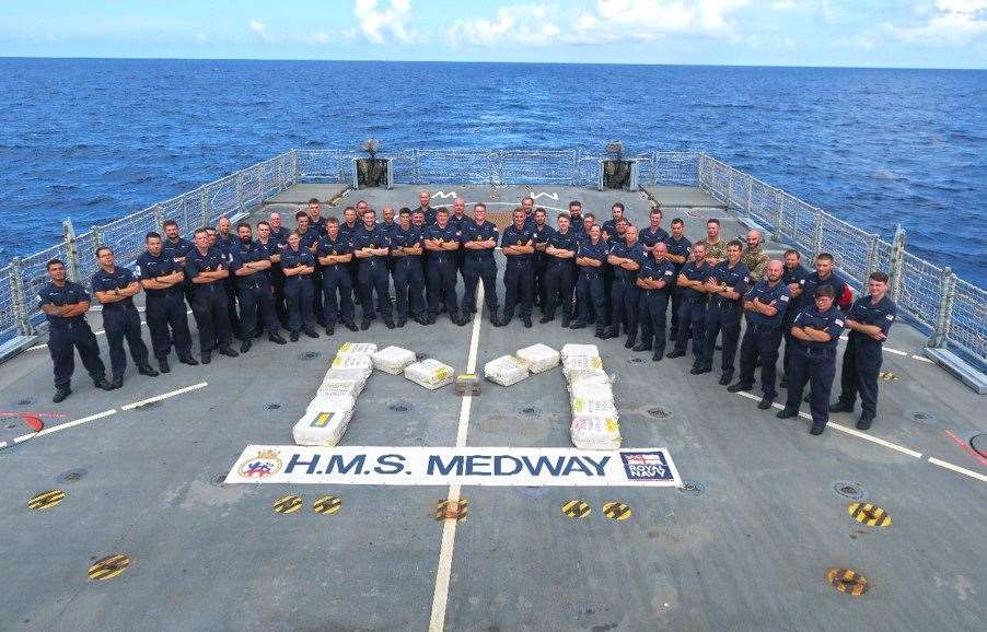 The crew of HMS Medway celebrate a successful drugs bust on the ship's flight deck after seizing a large haul of cocaine from drug runners across the Caribbean. Picture: Royal Navy/MoD