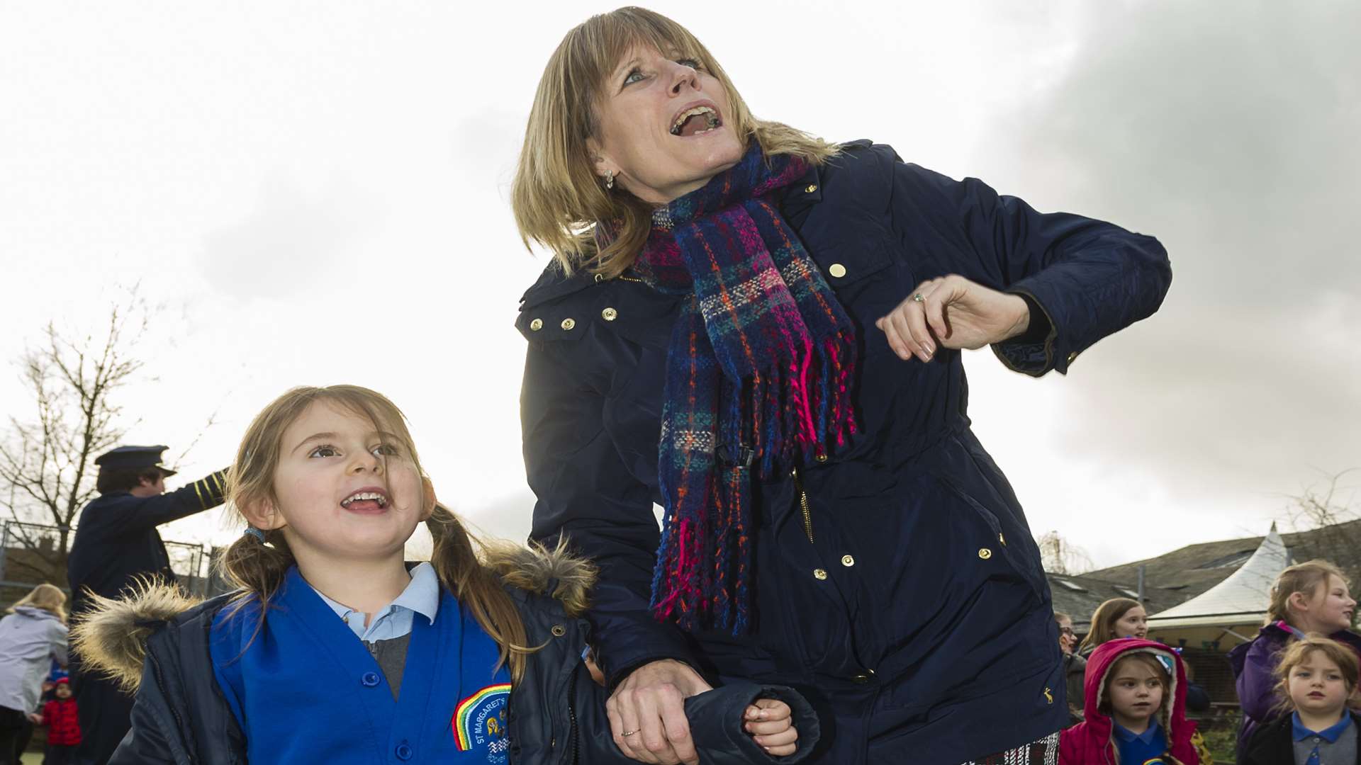 Elisha Head, four, and home school support worker Lynne Townsend watch the balloons heading away