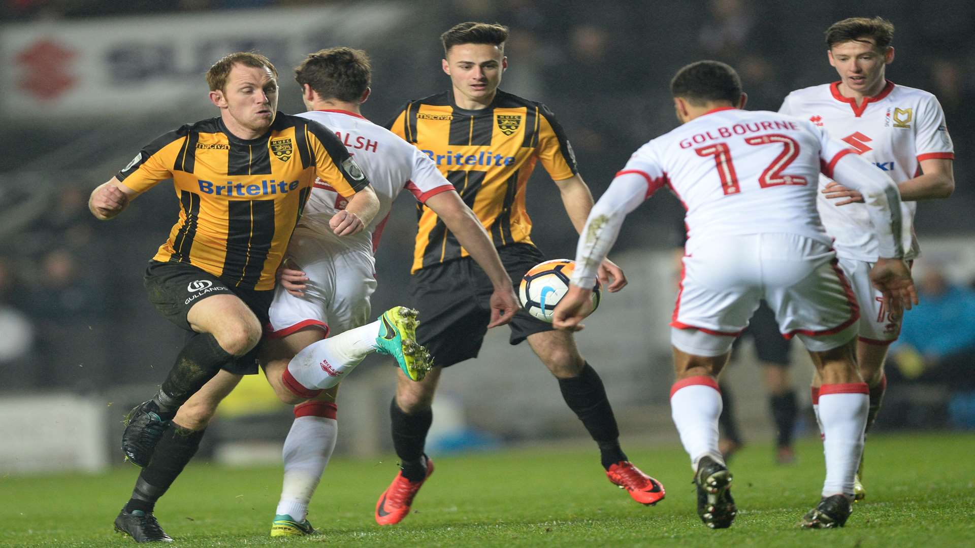 Maidstone's Stuart Lewis in the thick of the action. Picture: Ady Kerry