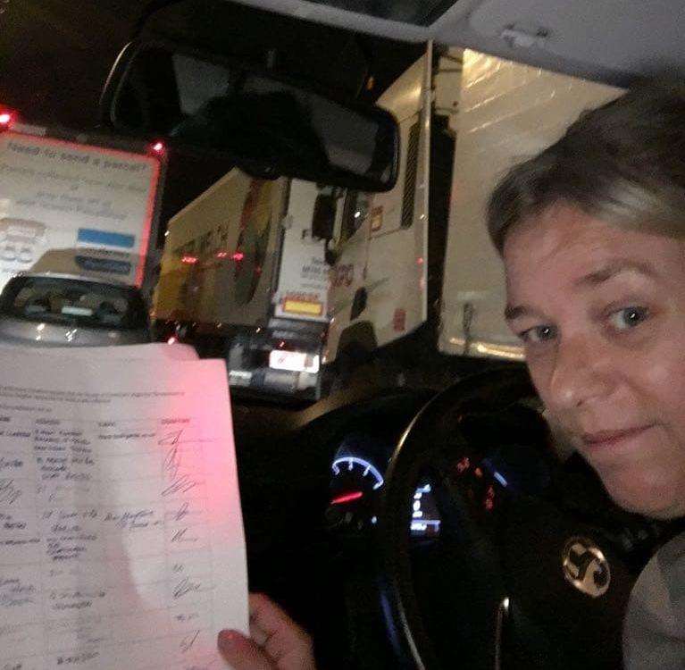 Helen May with the petition while stuck in the traffic late last night