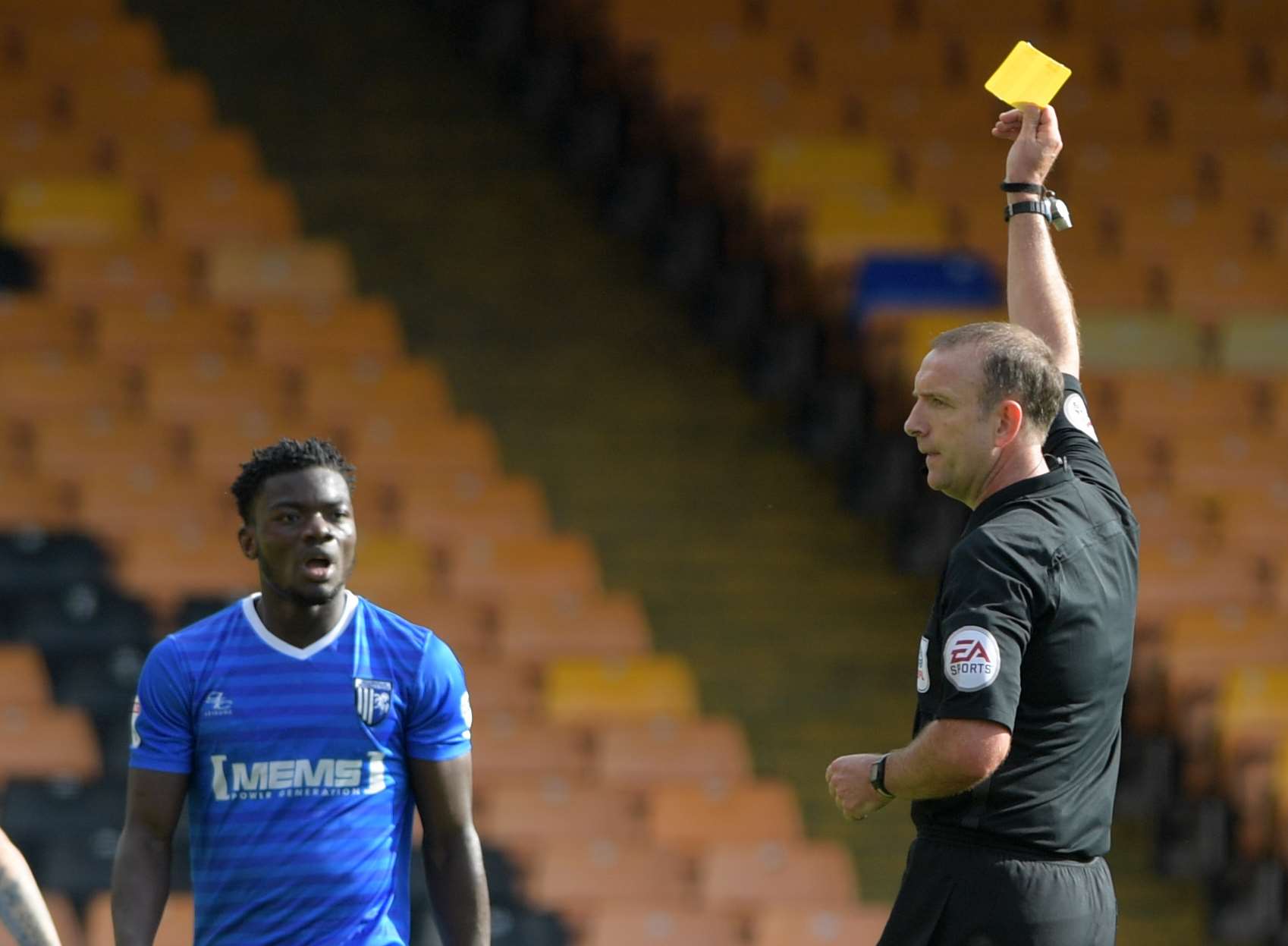 Deji Oshilaja is booked by Carl Boyeson but escapes a second caution Picture: Barry Goodwin