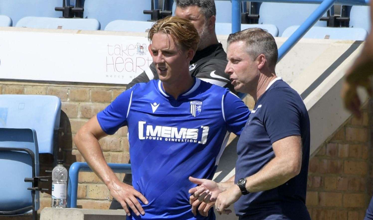 Will Wright with manager Neil Harris. Picture: Barry Goodwin