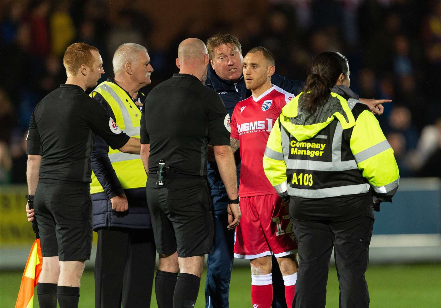 A frustrated Paul Raynor and defender Barry Fuller with match officials at the final whistle after Gills' defeat to AFC Wimbledon in November Picture: Ady Kerry