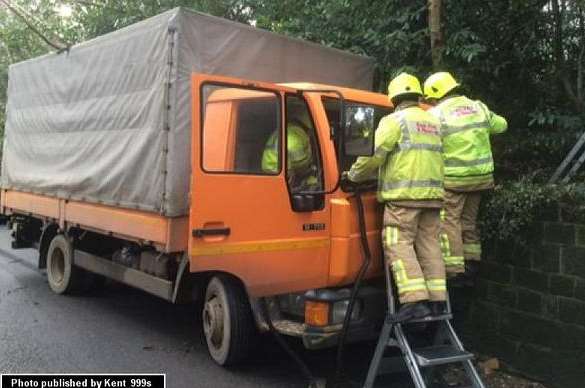 Firefighters helped to free a man trapped in the cab
