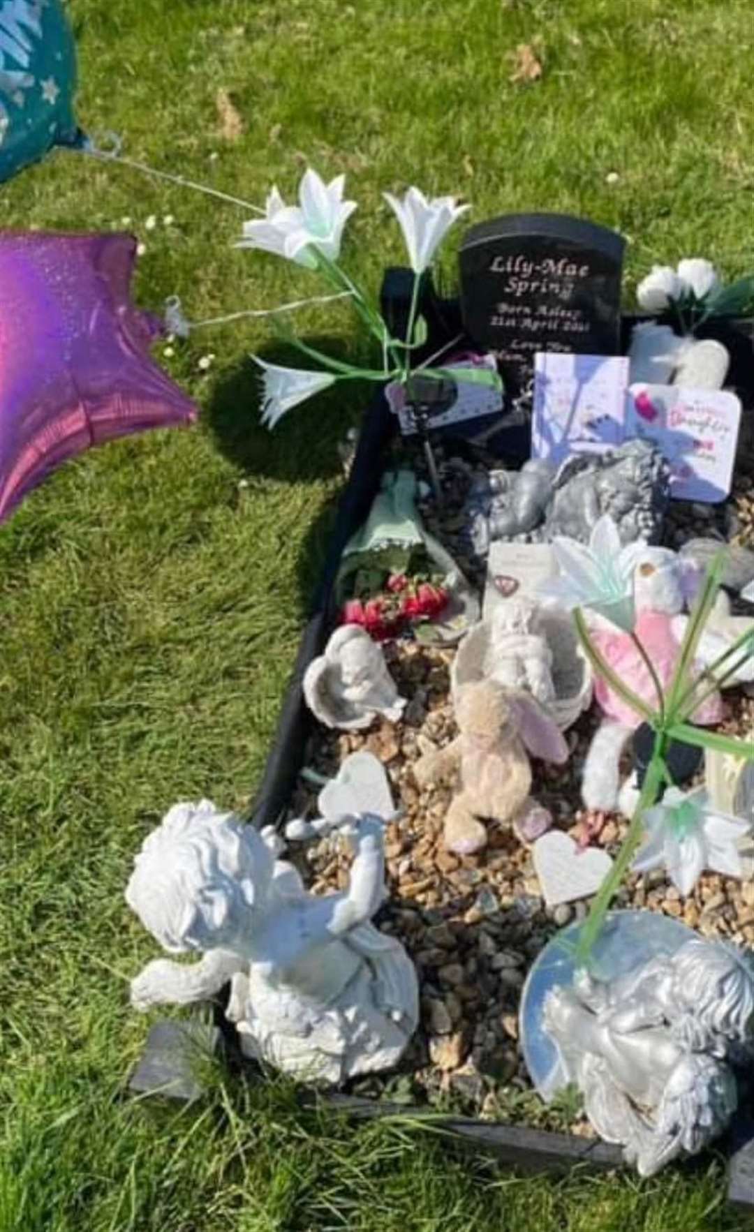 Lily-Mae Spring's grave was decorated with flowers, stuffed toys and ornaments before being vandalised. Picture: Shannon Spring