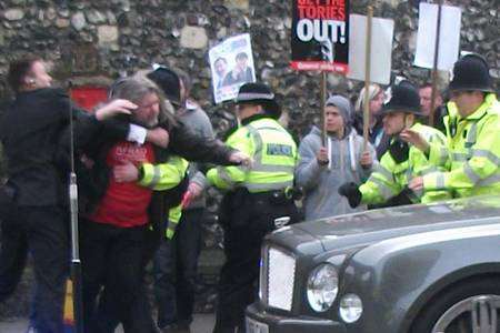 Scene of chaos as police surround protester ahead of the Archbishop of Canterbury's enthronement.