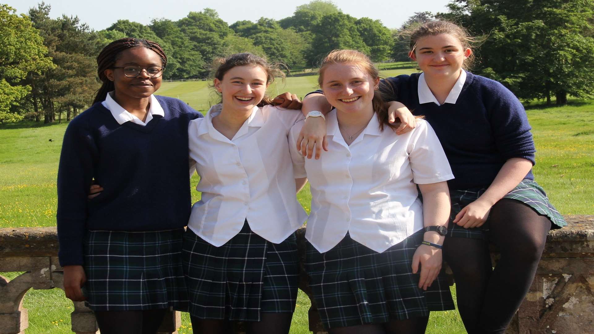 GCSE results day at Benenden School, Benenden. Pictured are Ifeoluwa Adeogun, Caitlin Gluckstein, Flo Plant and Lexi Hardee, all of whom achieved at least 11 A* or A grades this morning