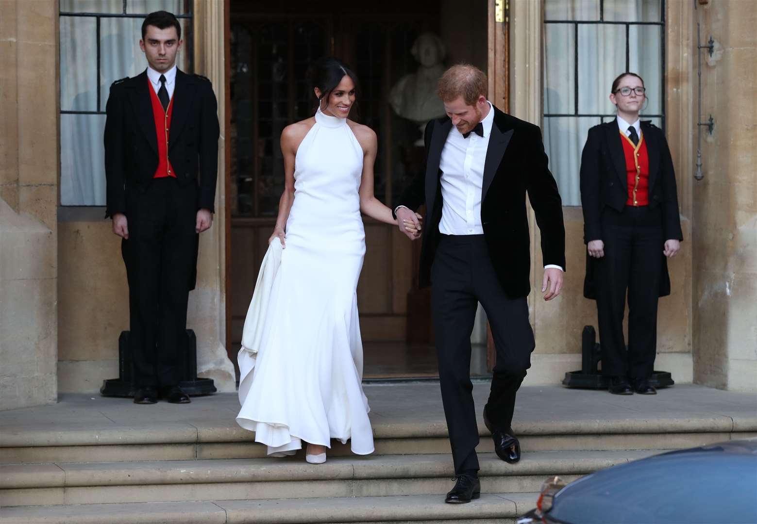 The newly married Duke and Duchess of Sussex heading to their evening reception (Steve Parsons/PA)