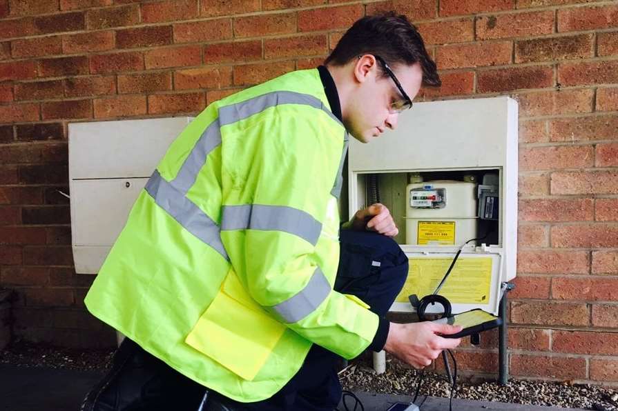 An engineer installing a new meter