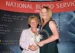 Anne-Marie Cunningham is presented with her award by Julie Henderson