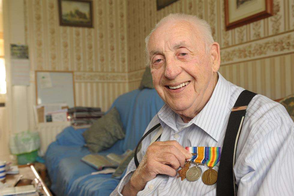 John Stewart with his dad's WW1 medals