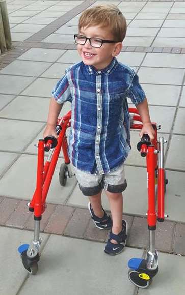 Theo Knott can only walk with the aid of his walker