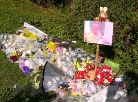 Bouquets and a photograph have been left at the lake