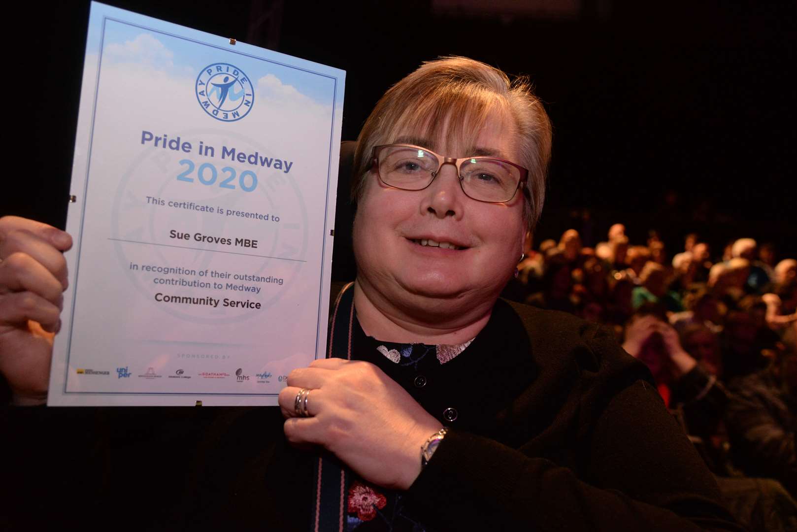 Sue Groves MBE with her community service certificate