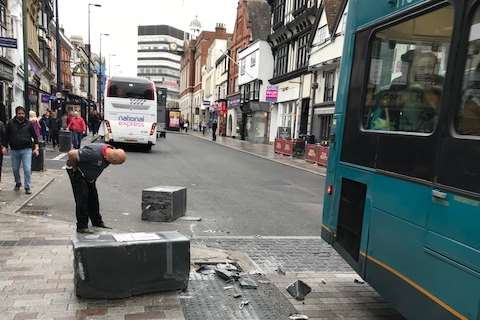 The bus crashed into the traffic calming island