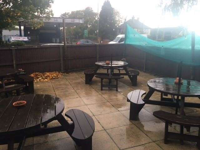 It was far too wet for anyone to even consider sitting outside but there is plenty of seating inside the fence at the front of the pub when the weather is better (60536991)