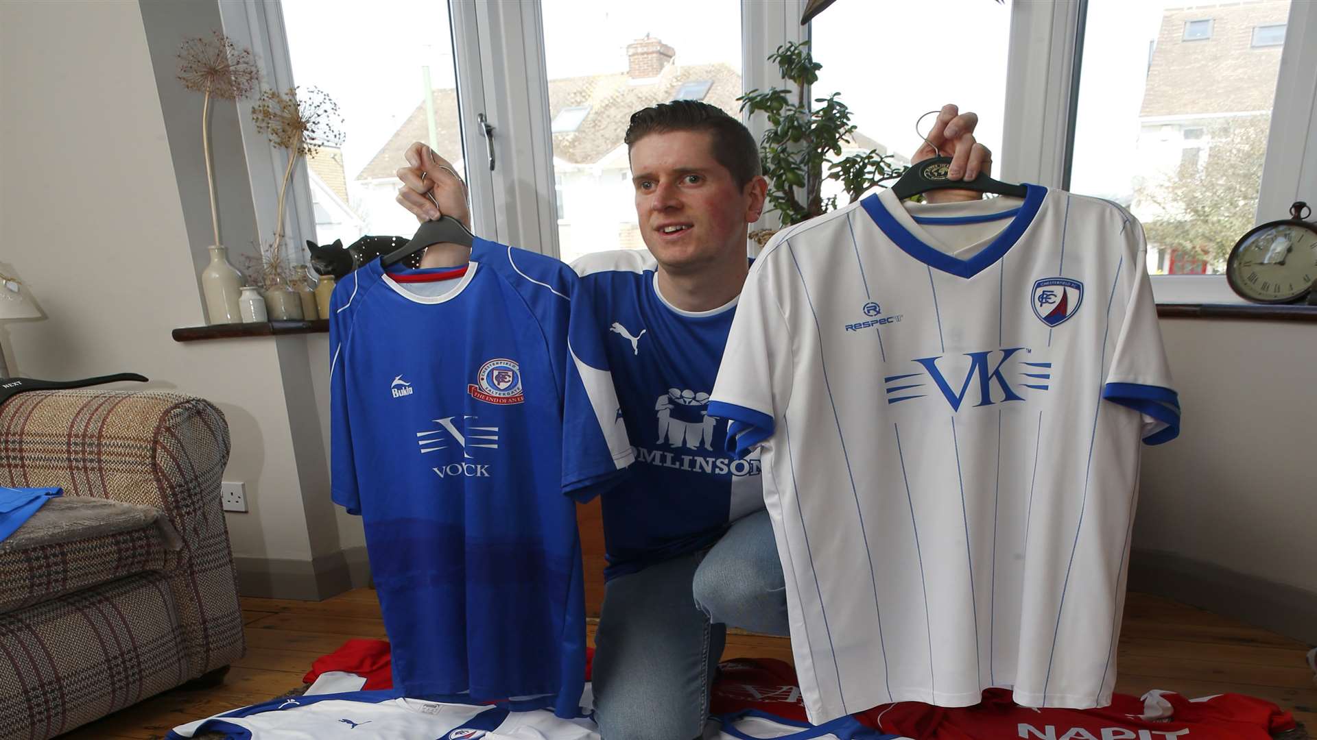 Kieran travels to every home and away game and collects replica shirts