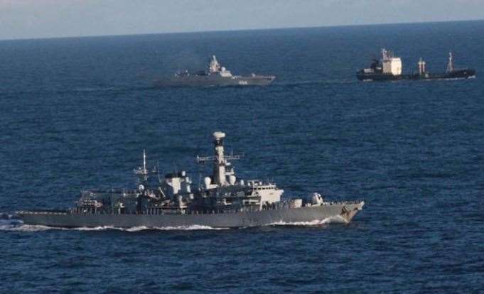HMS Portland, front, tracking the Russian warship Admiral Gorshkov, background left, and its accompanying tanker Kama, background right. Picture: Ministry of Defence