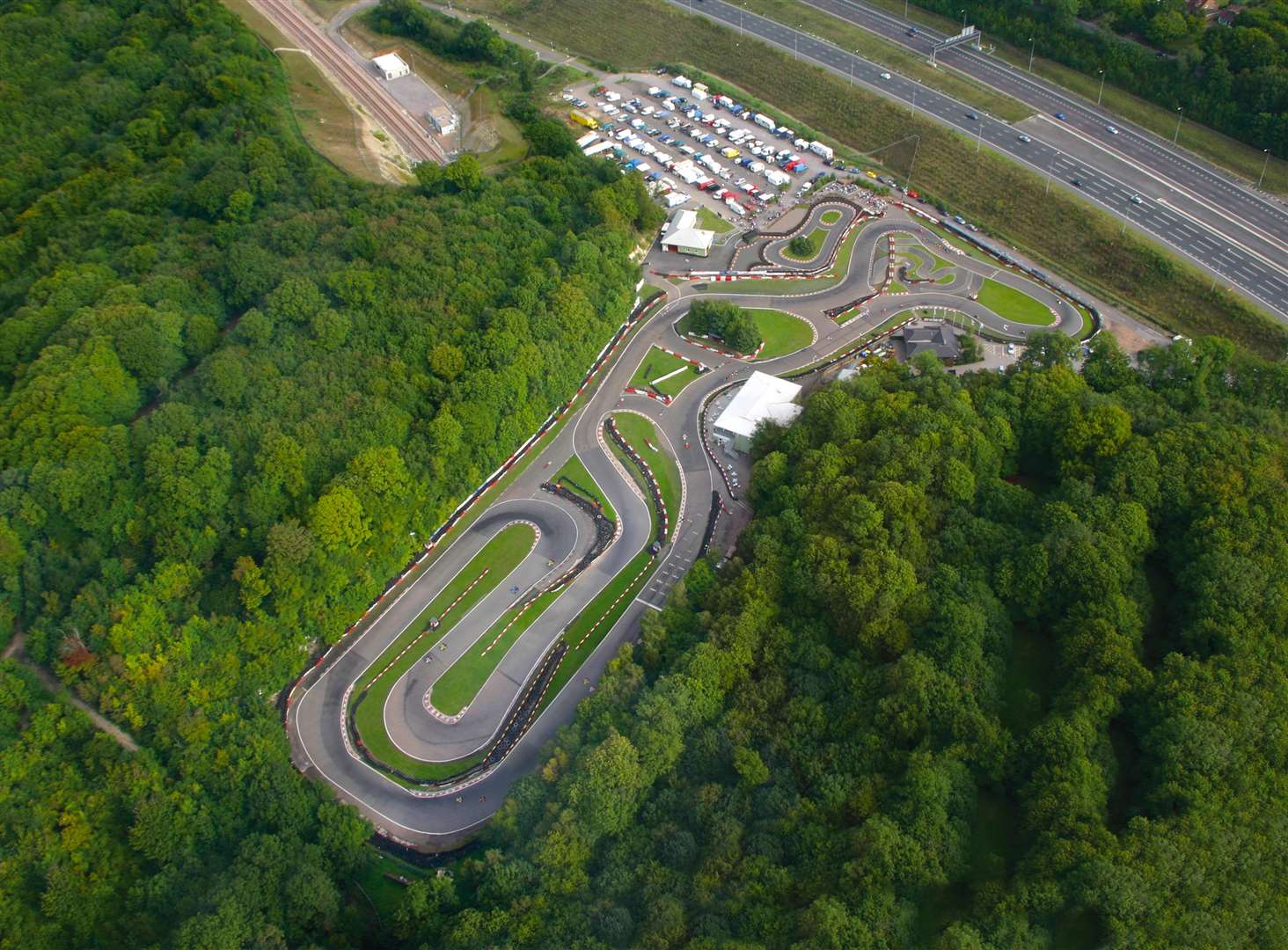 The 1,200-metre circuit south of Chatham lies within the Kent Downs Area of Outstanding Natural Beauty. It is surrounded by trees on three sides but to the east is exposed to open views from the elevated M2 motorway and Rochester Road