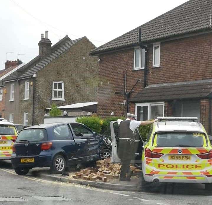 A police car collided with the front wall of a property in Long Lane Photo: Rebekah Jojo Scott