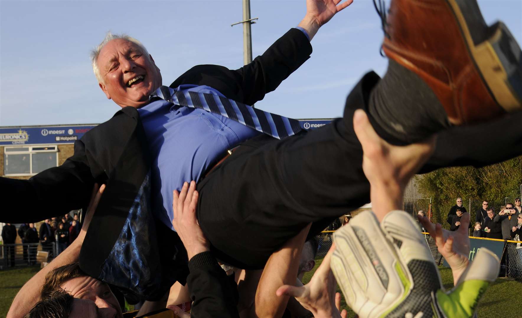 Neil Cugley is lifted aloft amid title celebrations. Picture: Gary Browne