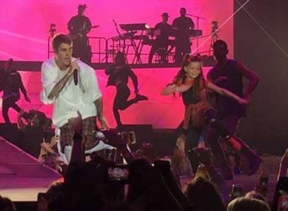 Ellie Rose Eames on stage with Justin Bieber
