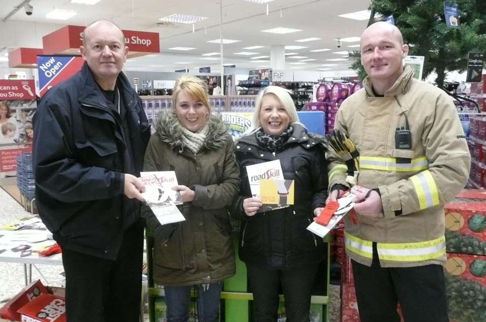Kirsty Johns and her mum Theresa pick up some safety tips from Watch Manager Alan Faulkner from the fire service community safety unit and crew manager John Howard from Dover Fire Station.