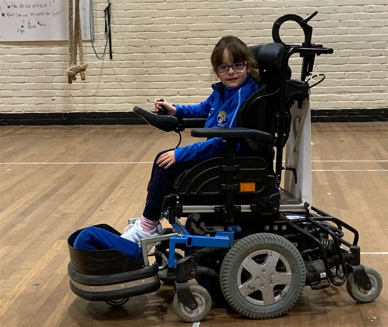 Bella Barton, from Faversham, using the hand-me-down football chair that she has learnt the game in. Picture: Leigh Turner