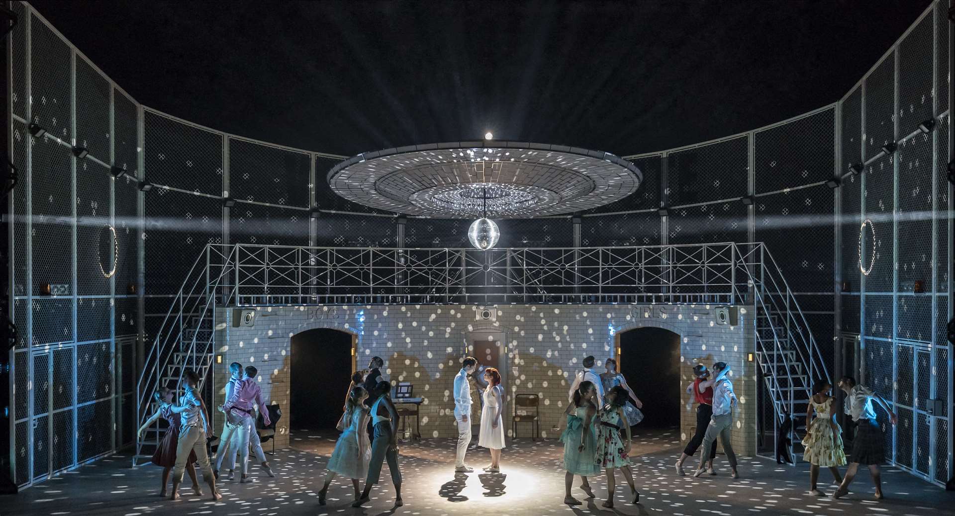 Romeo and Juliet met under the discoball at the Verona Institute dance. Matthew Bourne's Romeo and Juliet at the Marlowe Theatre. Credit: Johan Persson