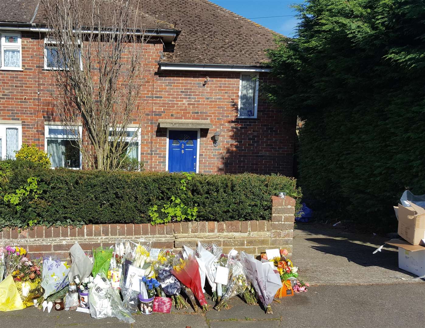 Flowers in Dickens Avenue, Canterbury after a brutal double murder in 2016.