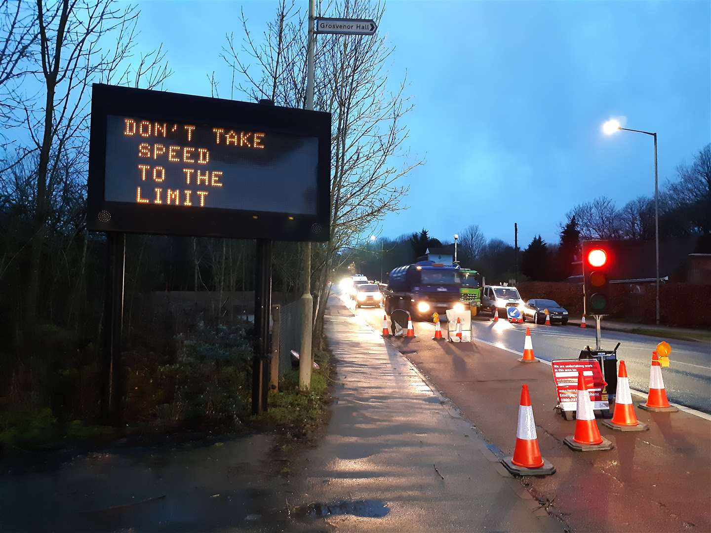 The temporary lights were installed next to a 'don't take speed to the limit' sign